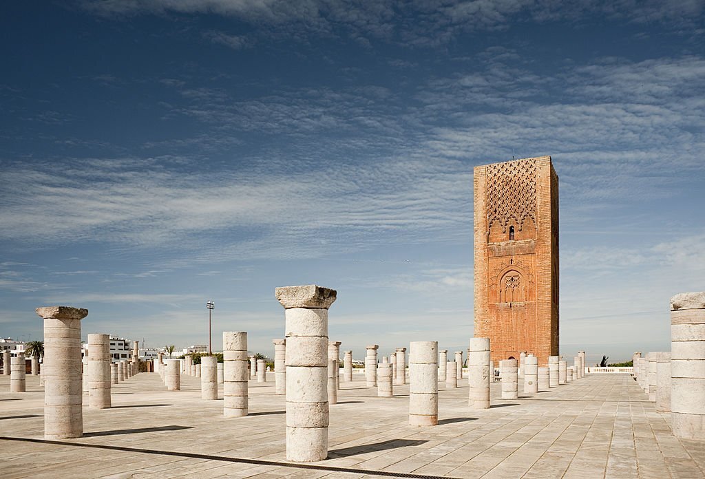 Columns of prayer hall and half completed minaret of mosque started in 12th century.